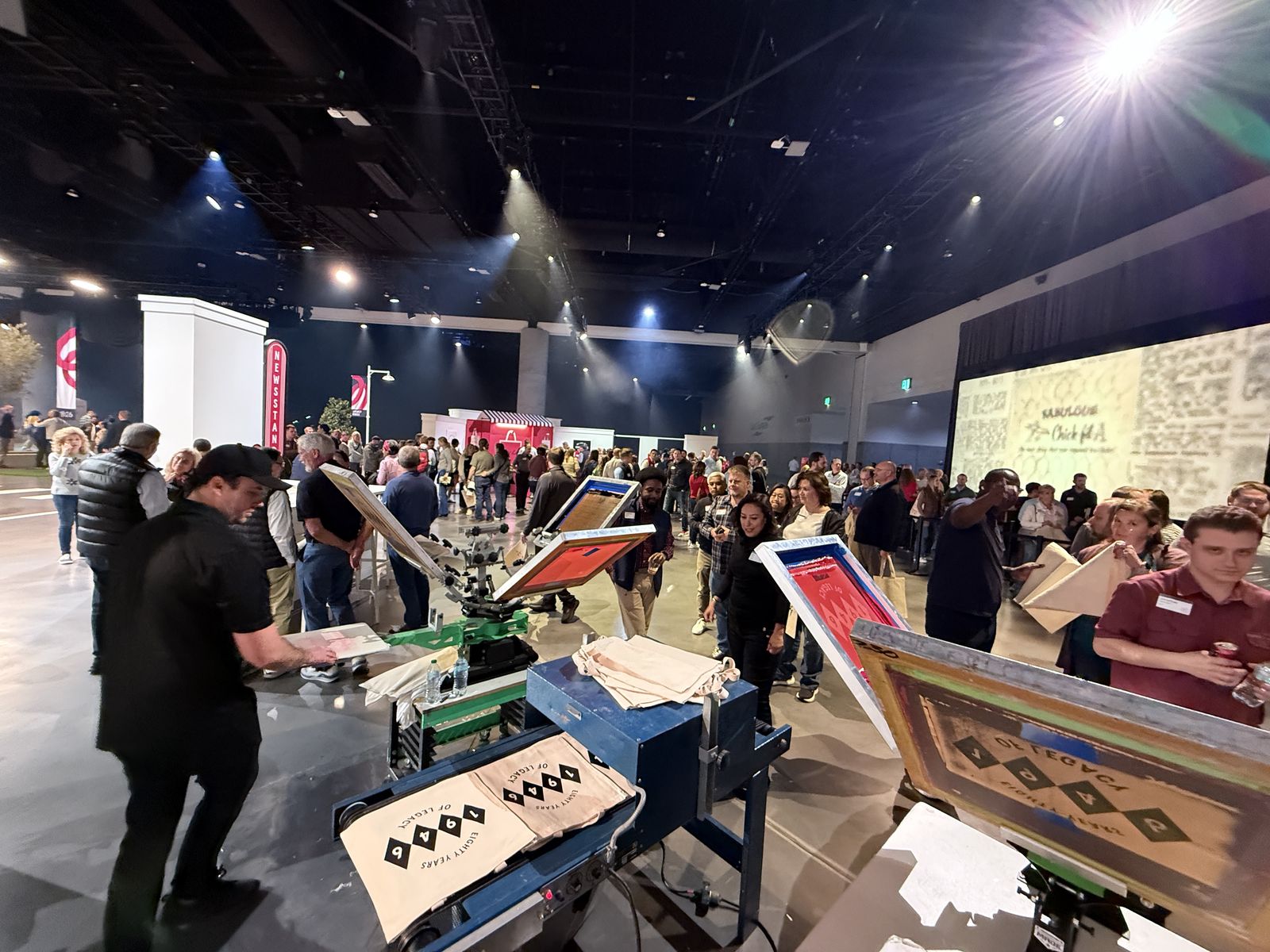 Merch Troop live screen-printing station running at a Sacramento event